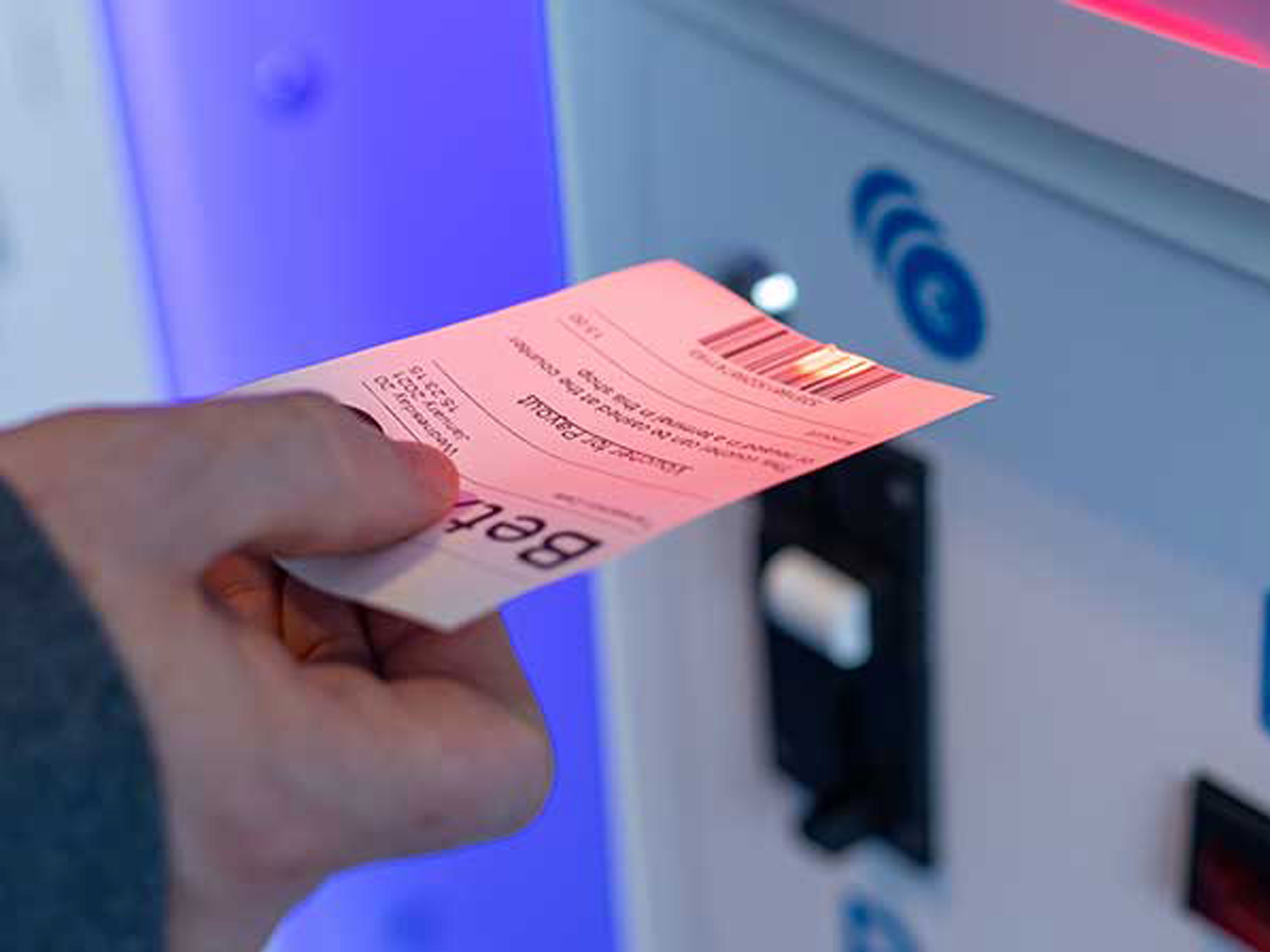 User scanning a ticket with Zebra's scanner