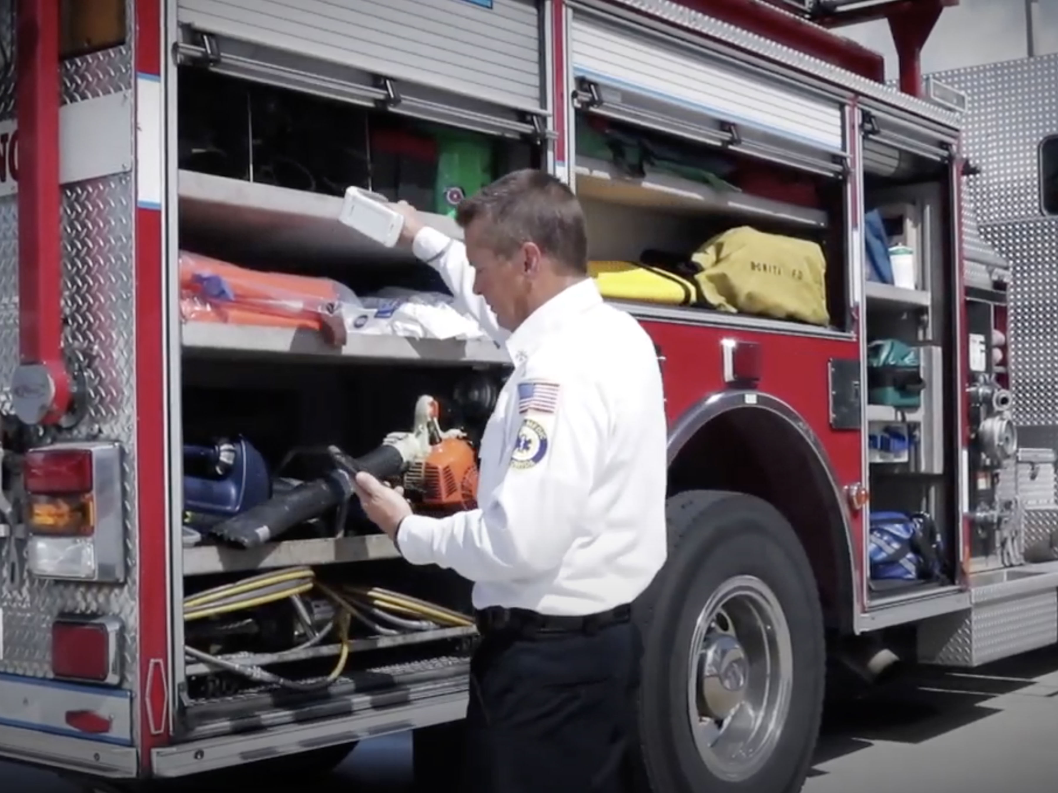Fireman arranging items in the truck