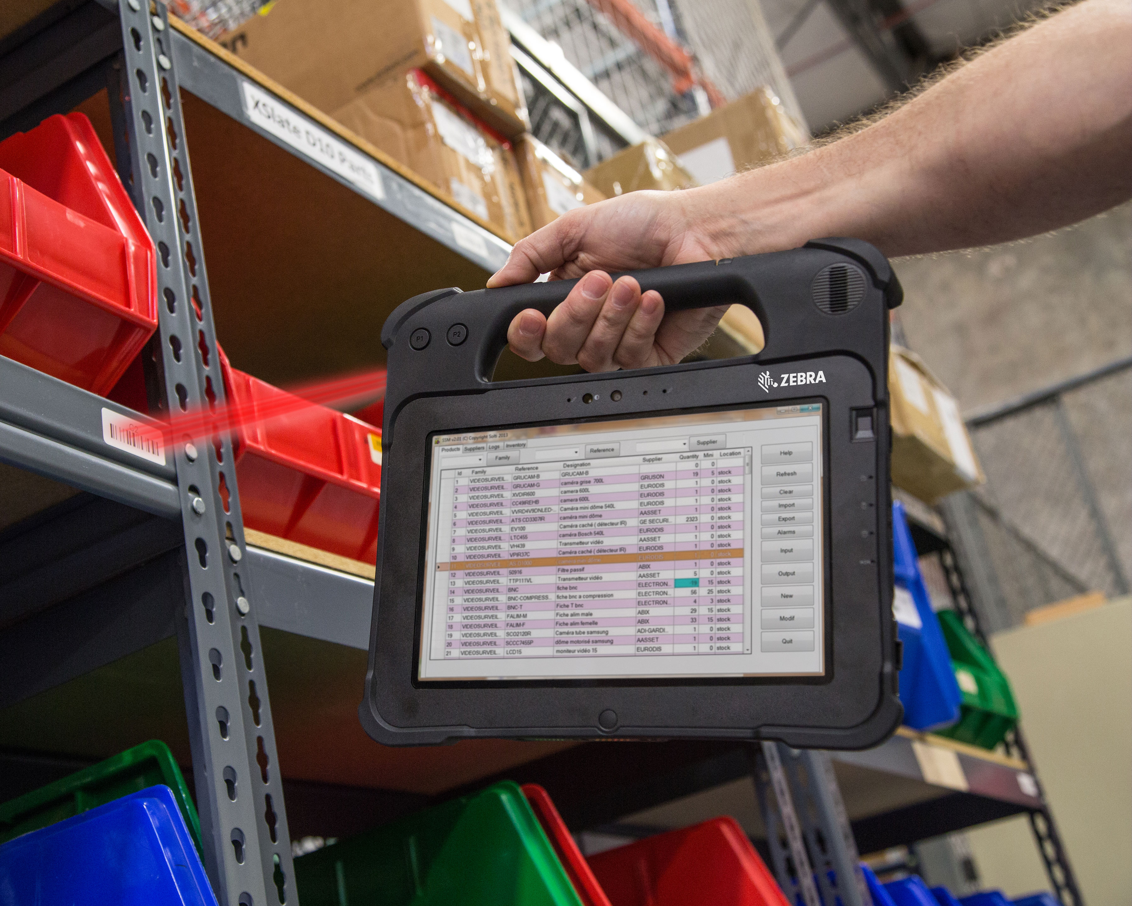 Zebra L10 rugged tablet scans a warehouse barcode