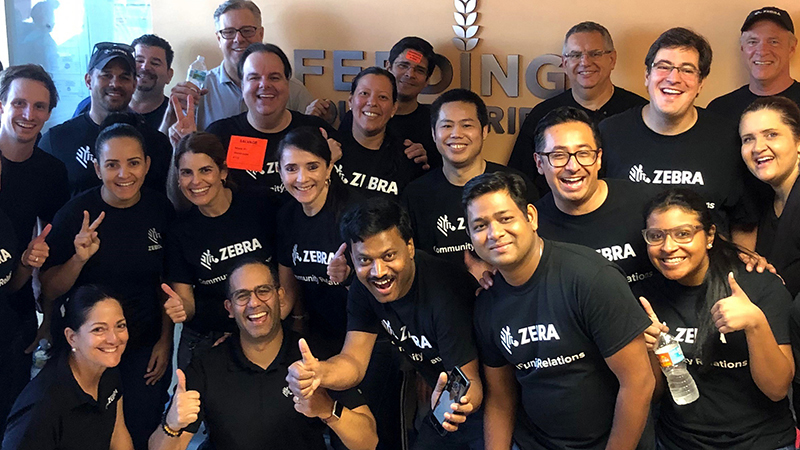 Zebra employees at an event wearing black t-shirts
