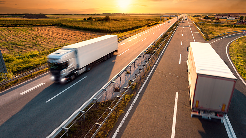 Electronic sensors used in trucks driving along a highway, showcasing Zebra's innovative environmental monitoring and sensing solutions for efficient transportation and logistics management.